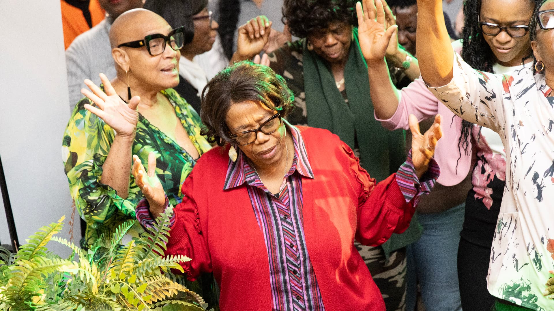 Worshippers with hands raised